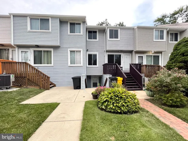 a view of a balcony with wooden floor and staircase