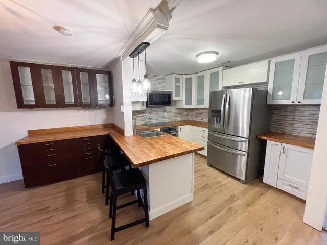 a view of a hallway with washer and dryer