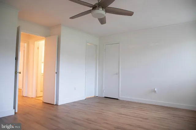 a white toilet sitting next to a bathroom