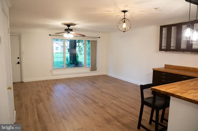 a kitchen with granite countertop a refrigerator stove and oven