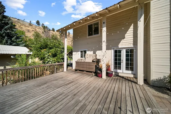 a view of a house with wooden deck