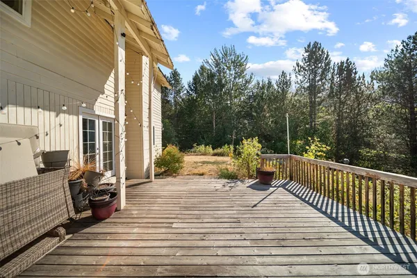 a view of a chair and tables in the balcony