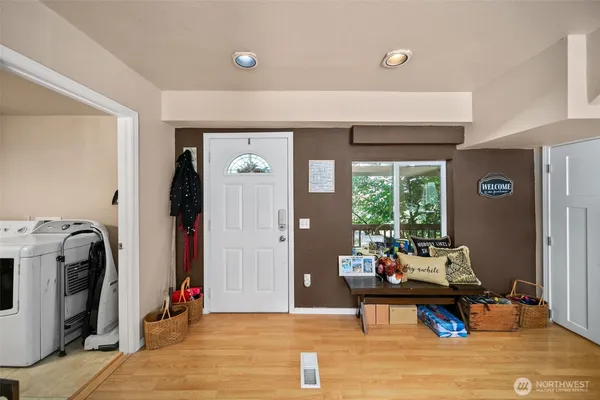 a living room with furniture and a mirror