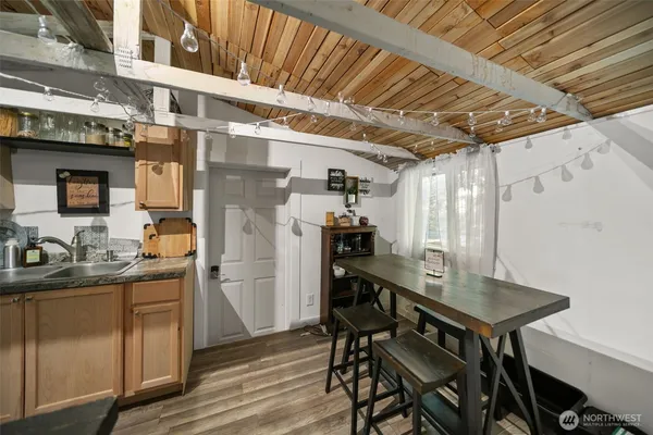 a kitchen with a table and chairs