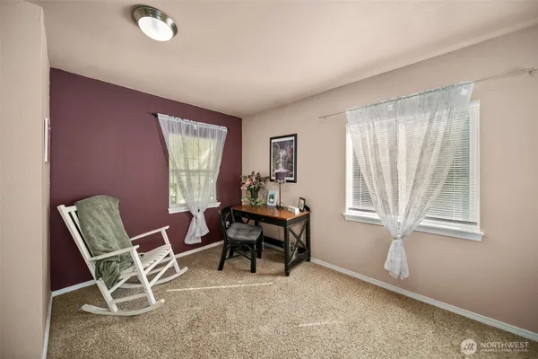 a work room with furniture and windows