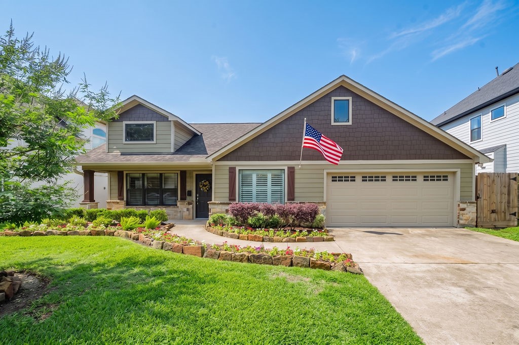 1731 Lamonte Lane Houston, TX 77018 - Photo 1 of 40 a front view of a house with a yard and garage