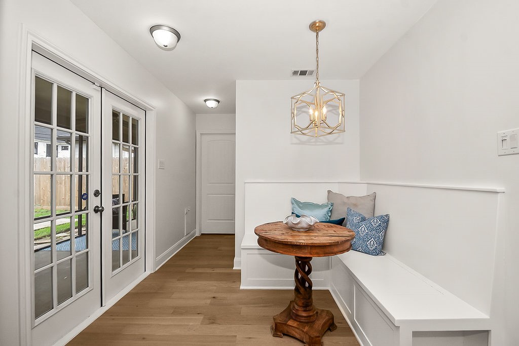 1731 Lamonte Lane Houston, TX 77018 - Photo 14 of 40 a view of a hallway with furniture and wooden floor