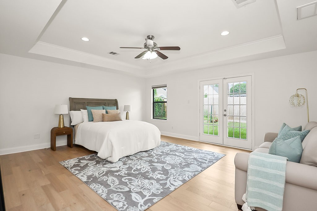 1731 Lamonte Lane Houston, TX 77018 - Photo 17 of 40 a bedroom with a large bed and a window