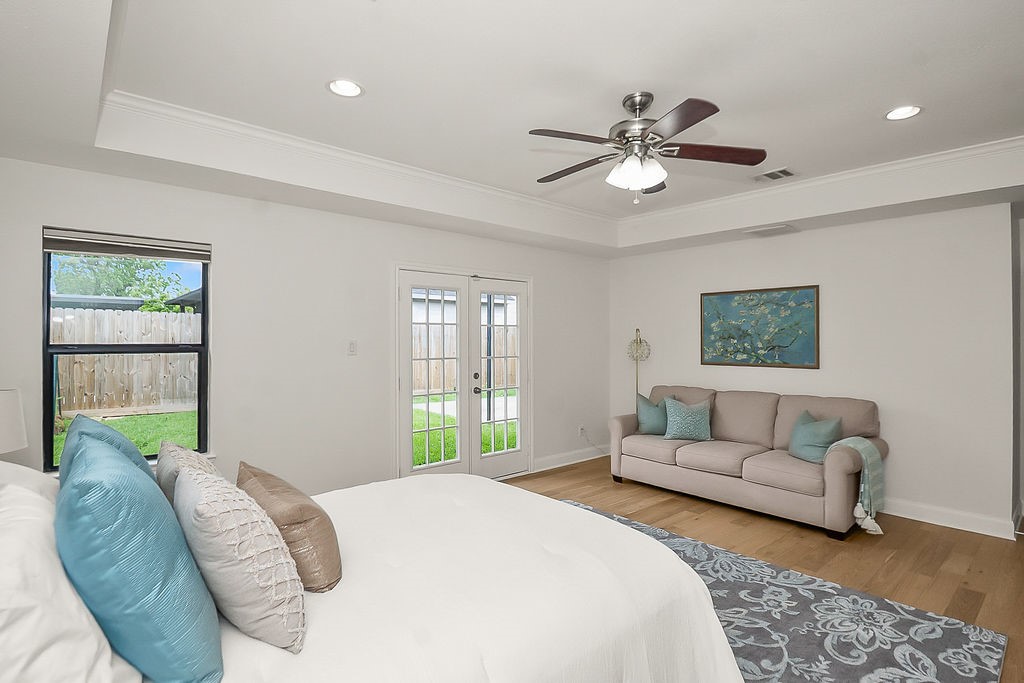 1731 Lamonte Lane Houston, TX 77018 - Photo 19 of 40 a bedroom with a bed and ceiling fan