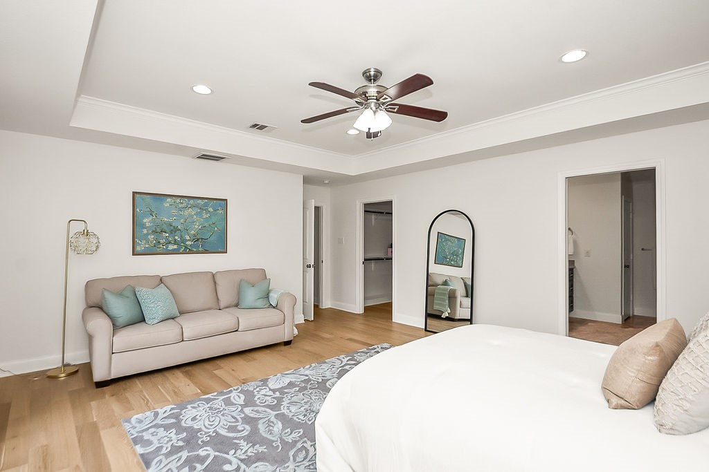 1731 Lamonte Lane Houston, TX 77018 - Photo 20 of 40 a spacious bedroom with a bed and a couch