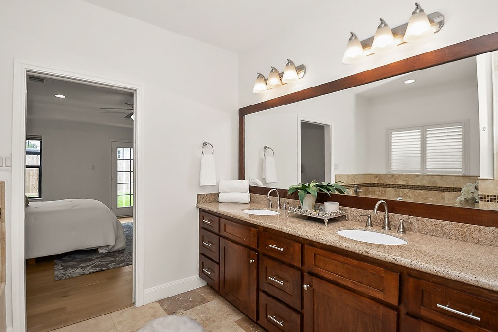1731 Lamonte Lane Houston, TX 77018 - Photo 24 of 40 a spacious bathroom with a double vanity sink and a mirror