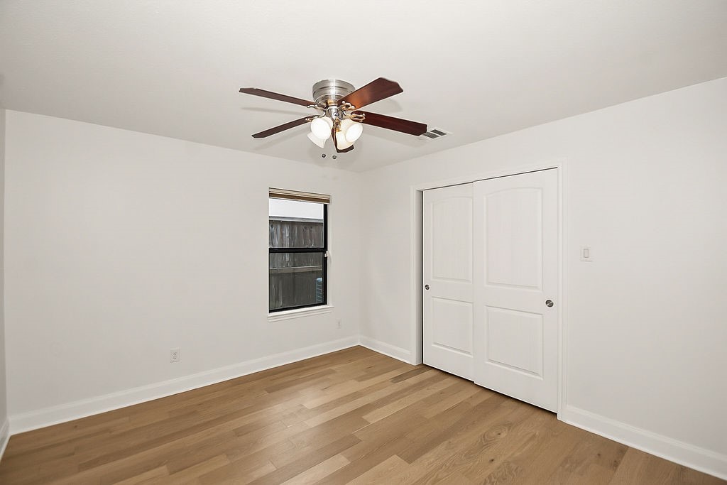 1731 Lamonte Lane Houston, TX 77018 - Photo 29 of 40 an empty room with wooden floor closet and ceiling fan