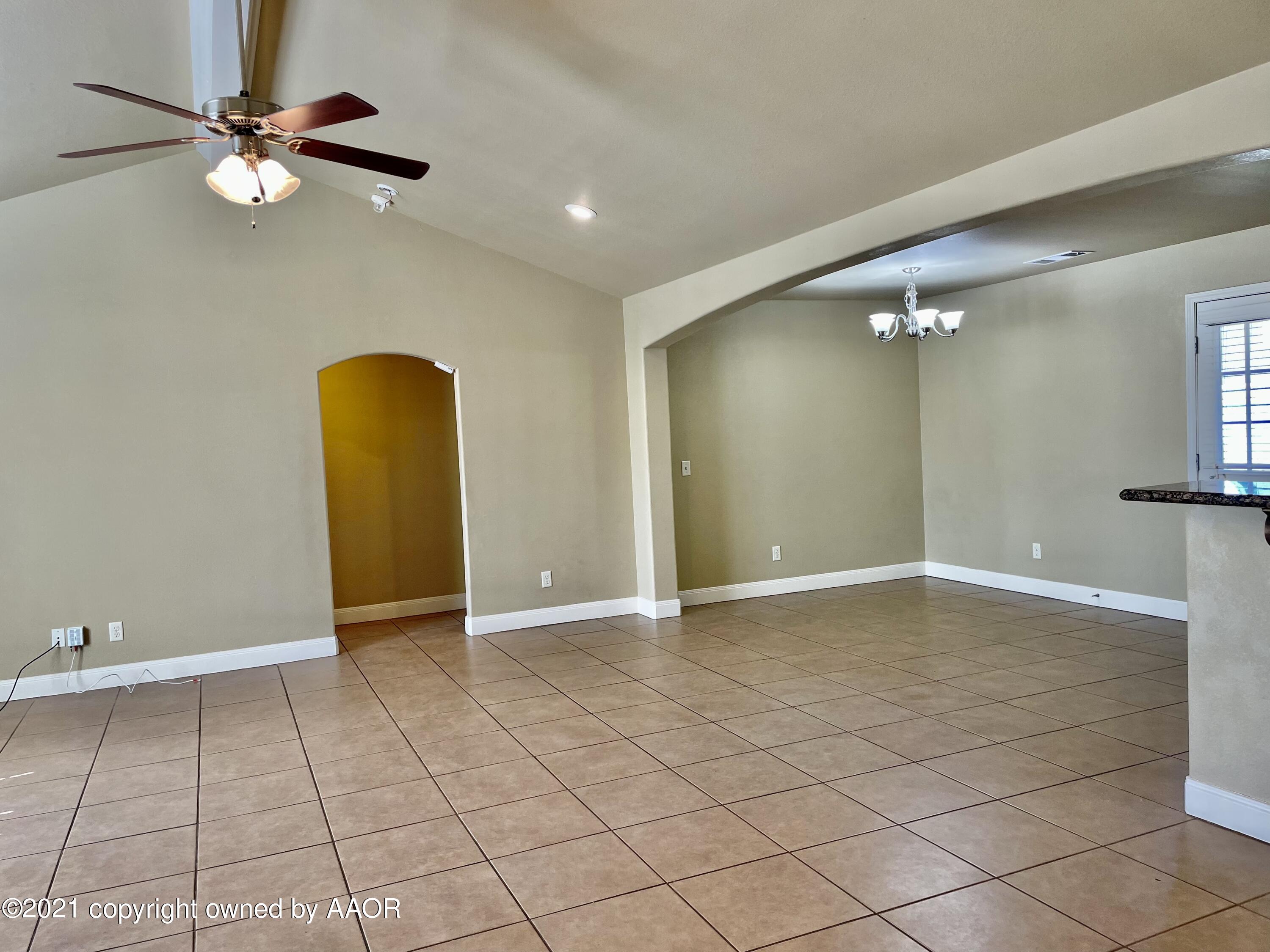 9812 Perry Avenue Amarillo, TX 79119 - Photo 4 of 15 an empty room with closet and fan