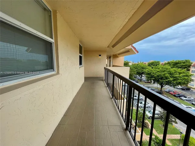 a view of a green field with a big yard