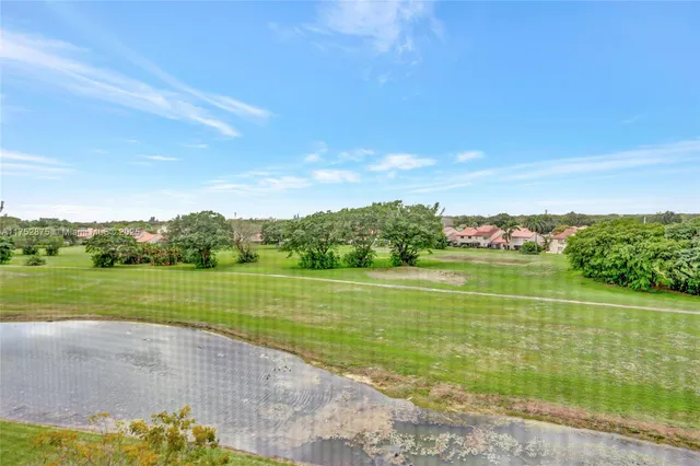 a living room with furniture and a chair