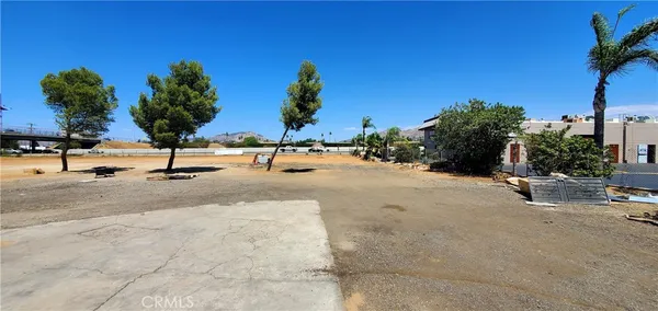 a view of a swimming pool with a lawn chairs