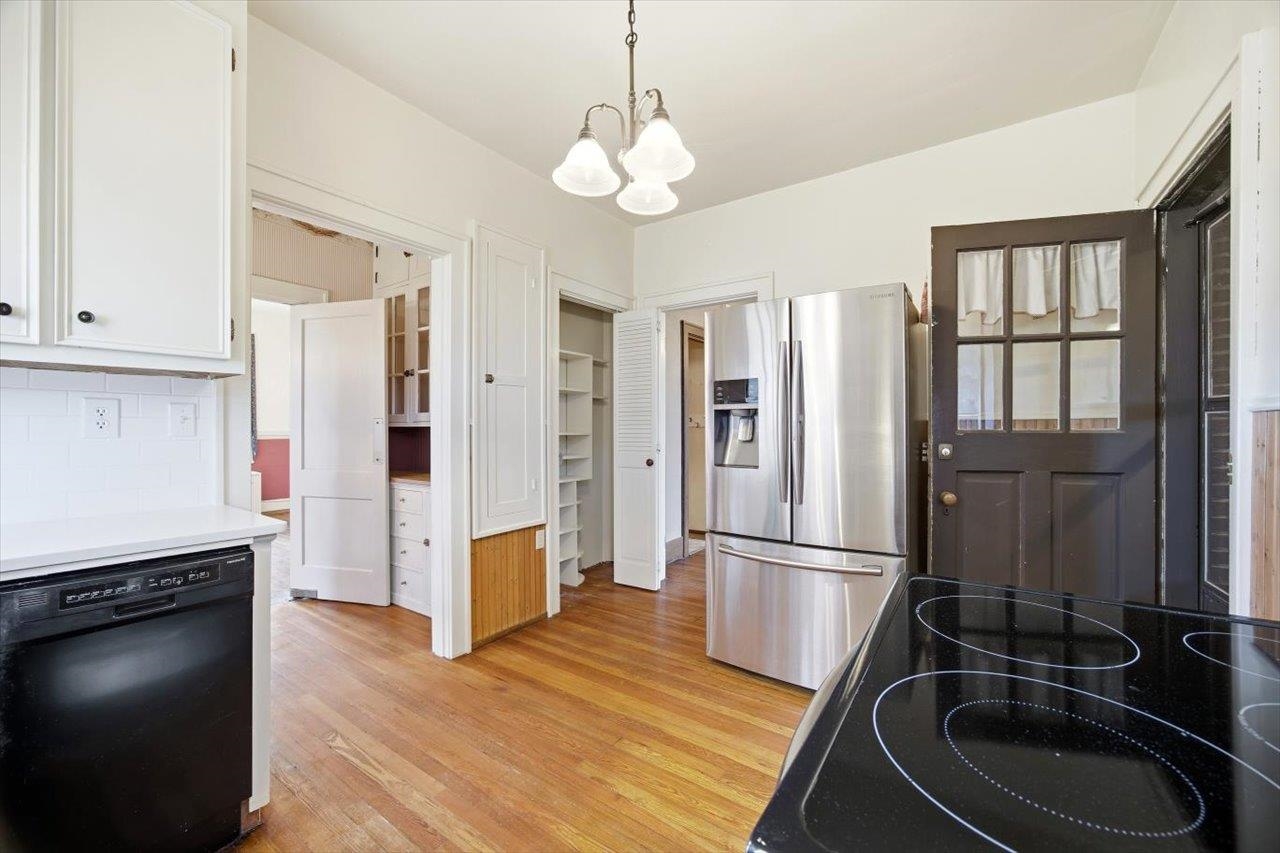 645 Maple Avenue Waynesboro, VA 22980 - Photo 11 of 63 a kitchen with stainless steel appliances granite countertop a refrigerator a stove and a wooden floors