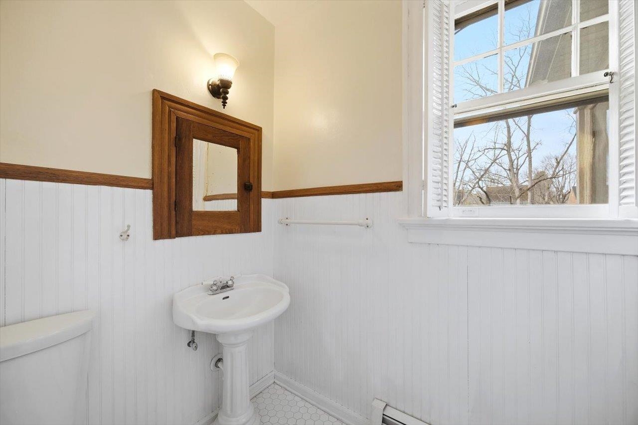 645 Maple Avenue Waynesboro, VA 22980 - Photo 27 of 63 a bathroom with a sink a mirror and a window