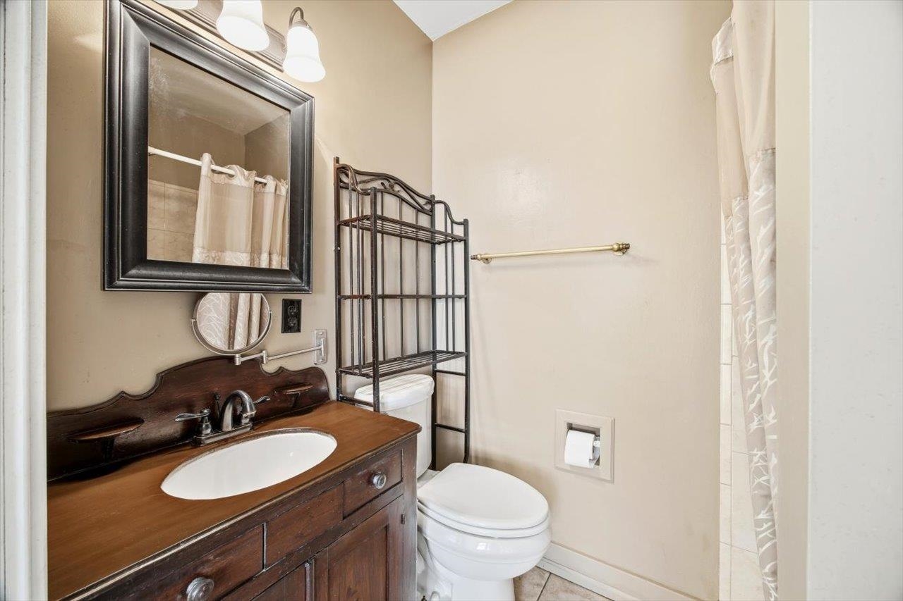 645 Maple Avenue Waynesboro, VA 22980 - Photo 35 of 63 a bathroom with a toilet a sink and mirror