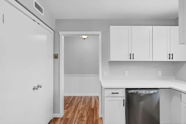 a utility room with cabinets