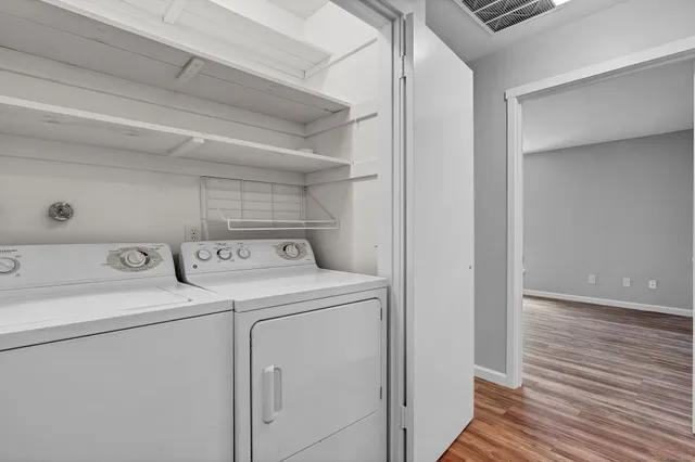 a view of a storage & utility room with washer and dryer