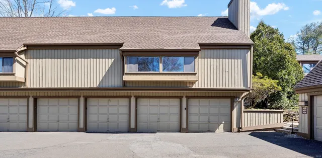 a front view of a house with garage