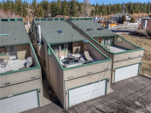 a view of a patio with iron fence