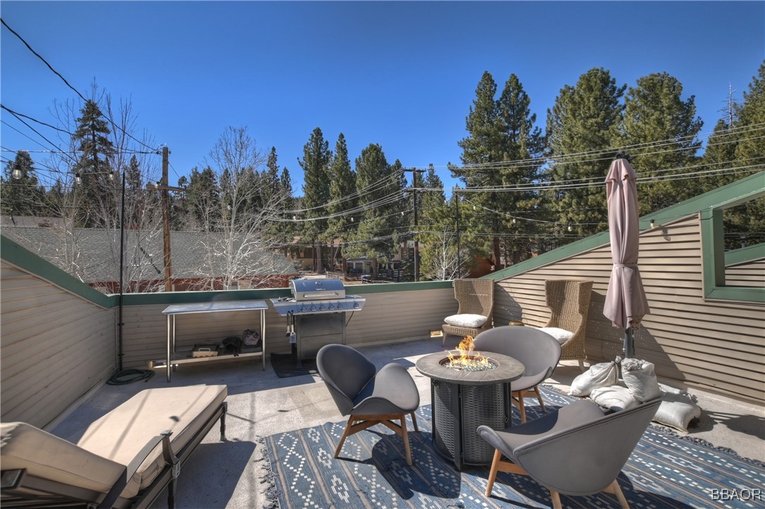 42533 Moonridge Road, Unit 4 Big Bear Lake, CA 92315 - Photo 24 of 37 a view of a patio with iron fence