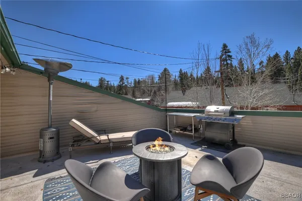 a view of a patio with iron fence