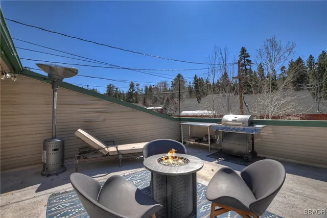 a view of a patio with iron fence