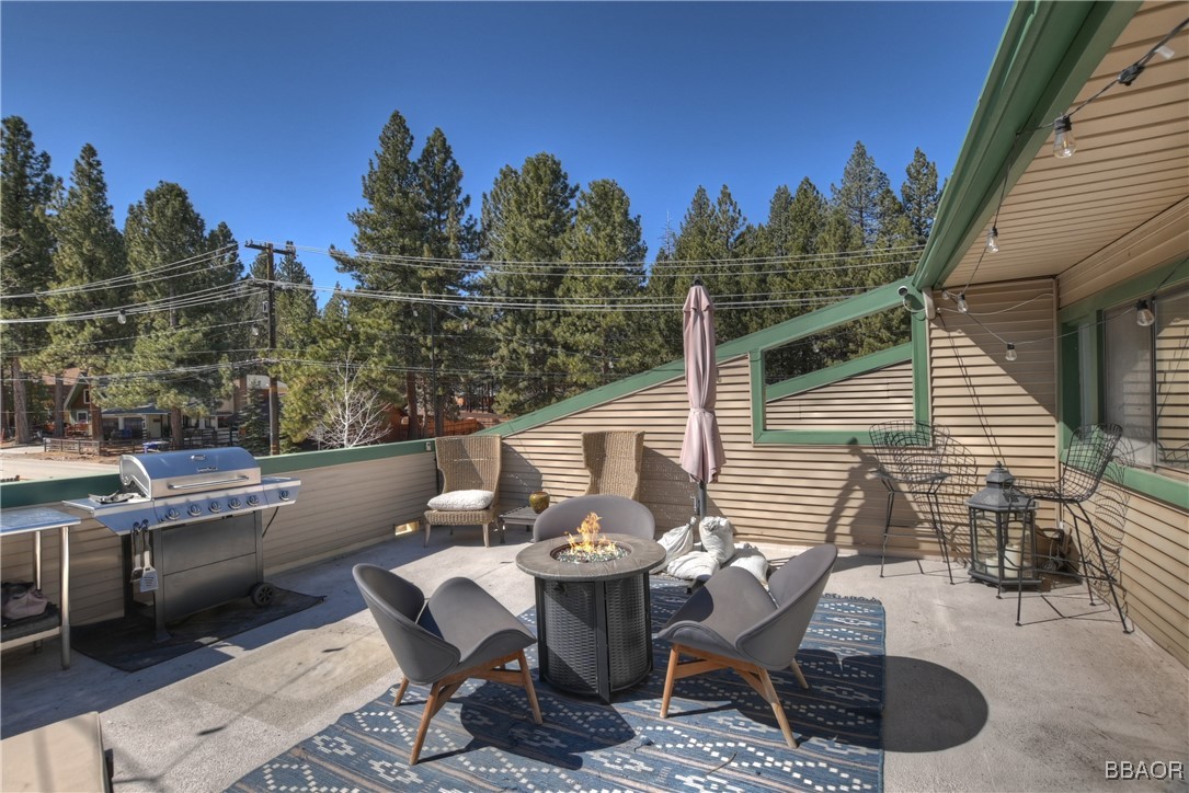 42533 Moonridge Road, Unit 4 Big Bear Lake, CA 92315 - Photo 26 of 37 a view of a patio with iron fence