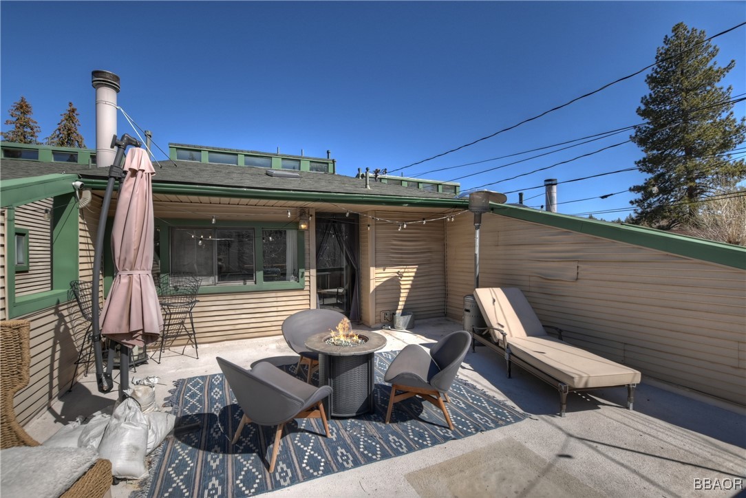 42533 Moonridge Road, Unit 4 Big Bear Lake, CA 92315 - Photo 28 of 37 a view of a patio with couple of chairs