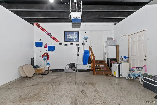 a view of a couches and a tables in the roof