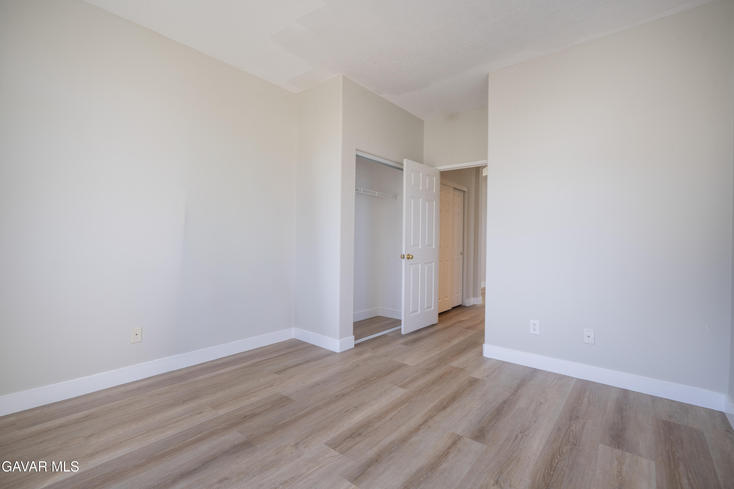 40271 Preston Road Palmdale, CA 93551 - Photo 14 of 38 a view of an empty room with wooden floor