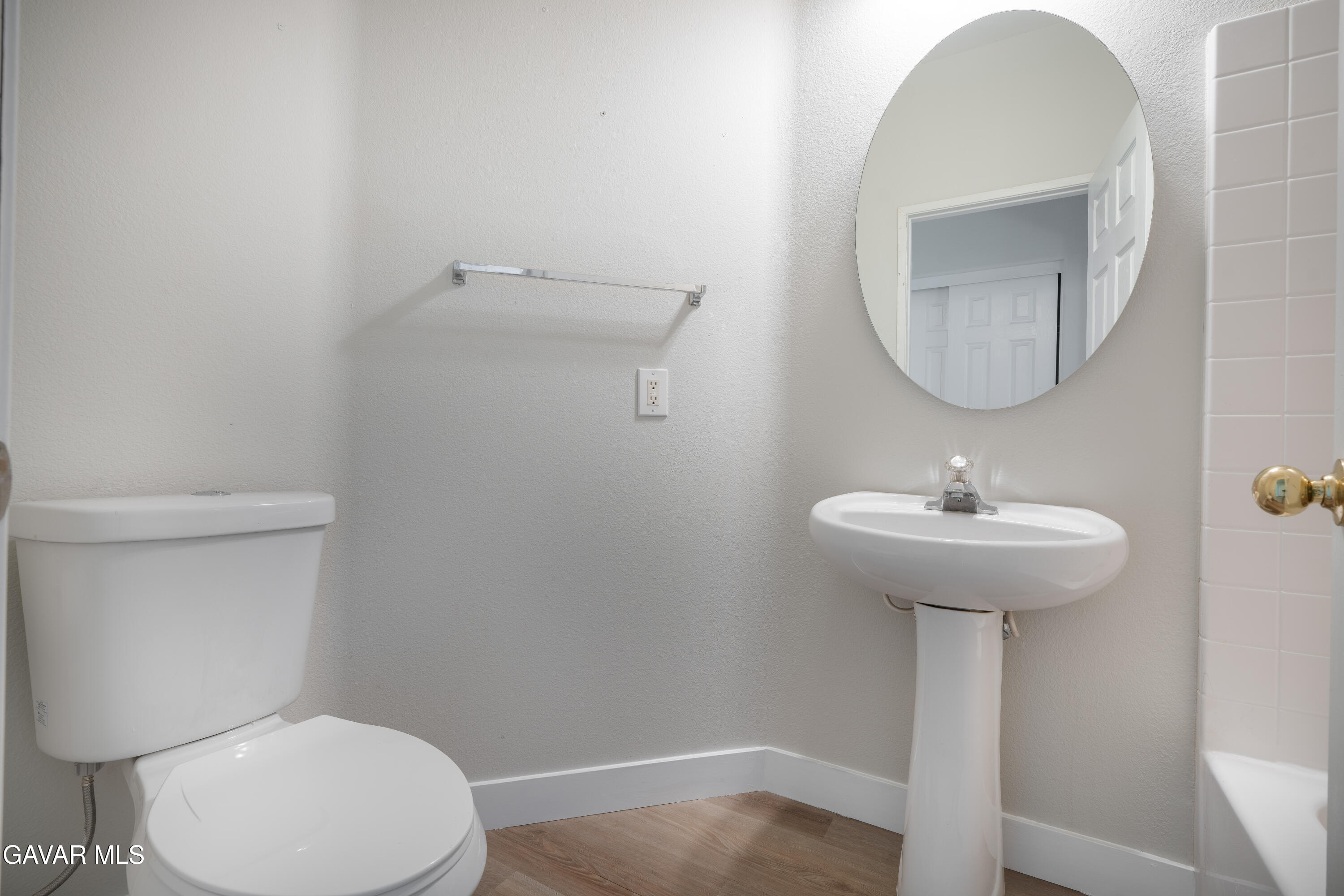 40271 Preston Road Palmdale, CA 93551 - Photo 15 of 38 a bathroom with a toilet a sink and mirror