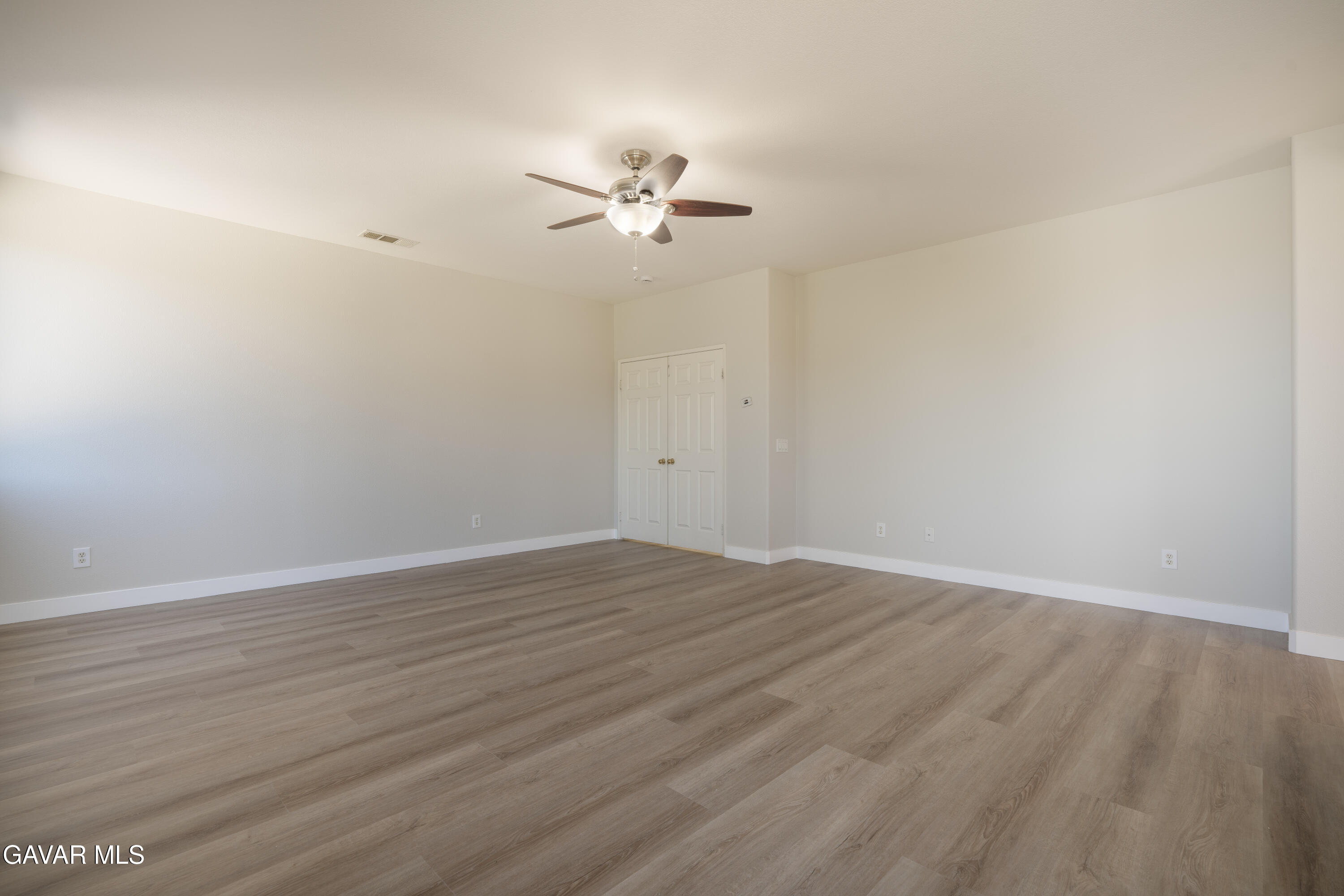 40271 Preston Road Palmdale, CA 93551 - Photo 18 of 38 a view of empty room with wooden floor
