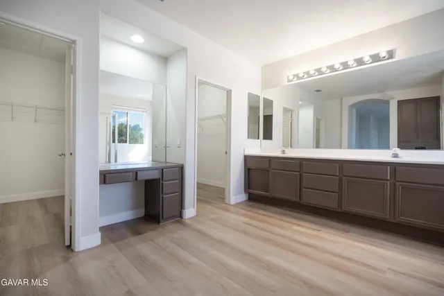 a view of a bathroom with sink and mirror