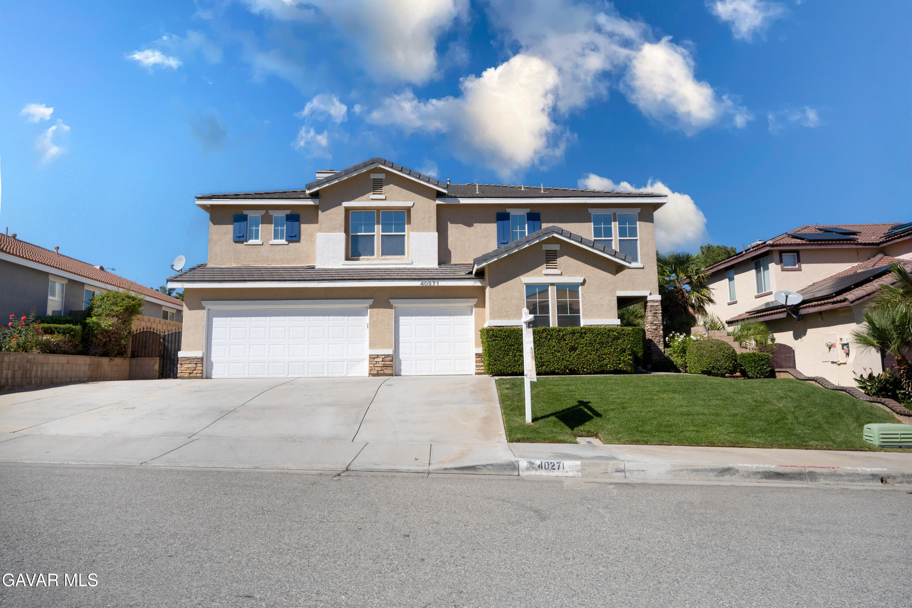 40271 Preston Road Palmdale, CA 93551 - Photo 2 of 38 a front view of a house with a yard and garage