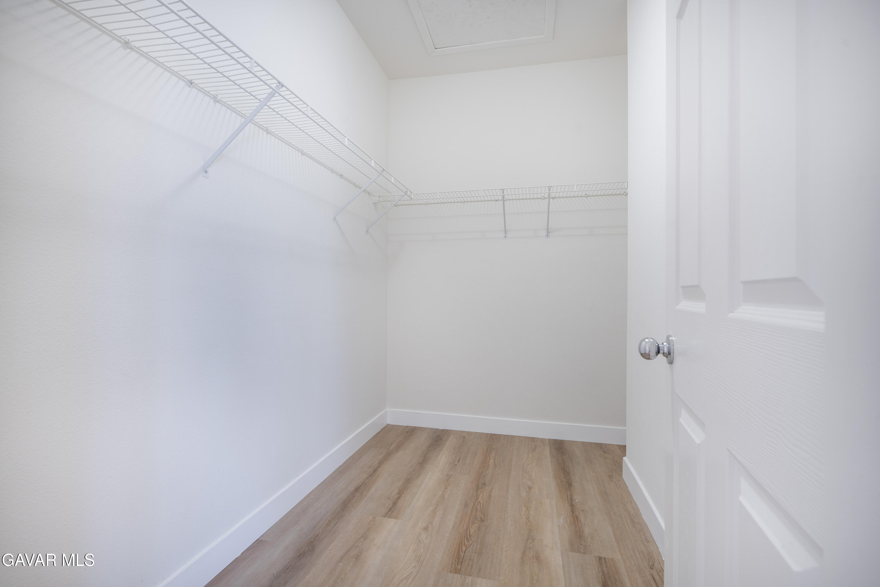 40271 Preston Road Palmdale, CA 93551 - Photo 23 of 38 a view of a room with racks on the wall