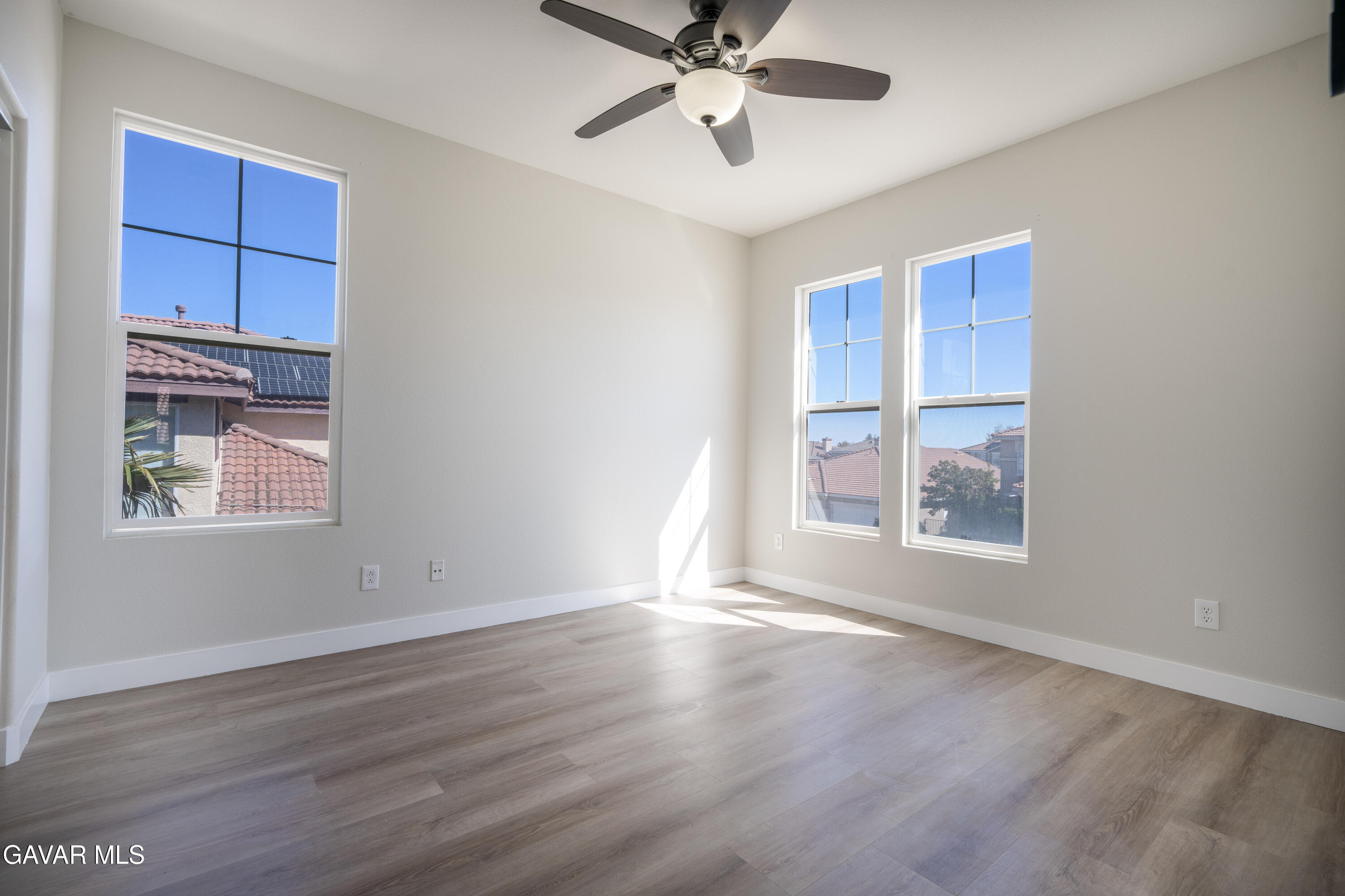 40271 Preston Road Palmdale, CA 93551 - Photo 25 of 38 a view of an empty room with a window and wooden floor