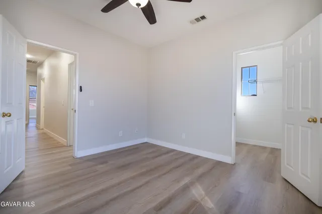 a bathroom with a double vanity sink and mirror