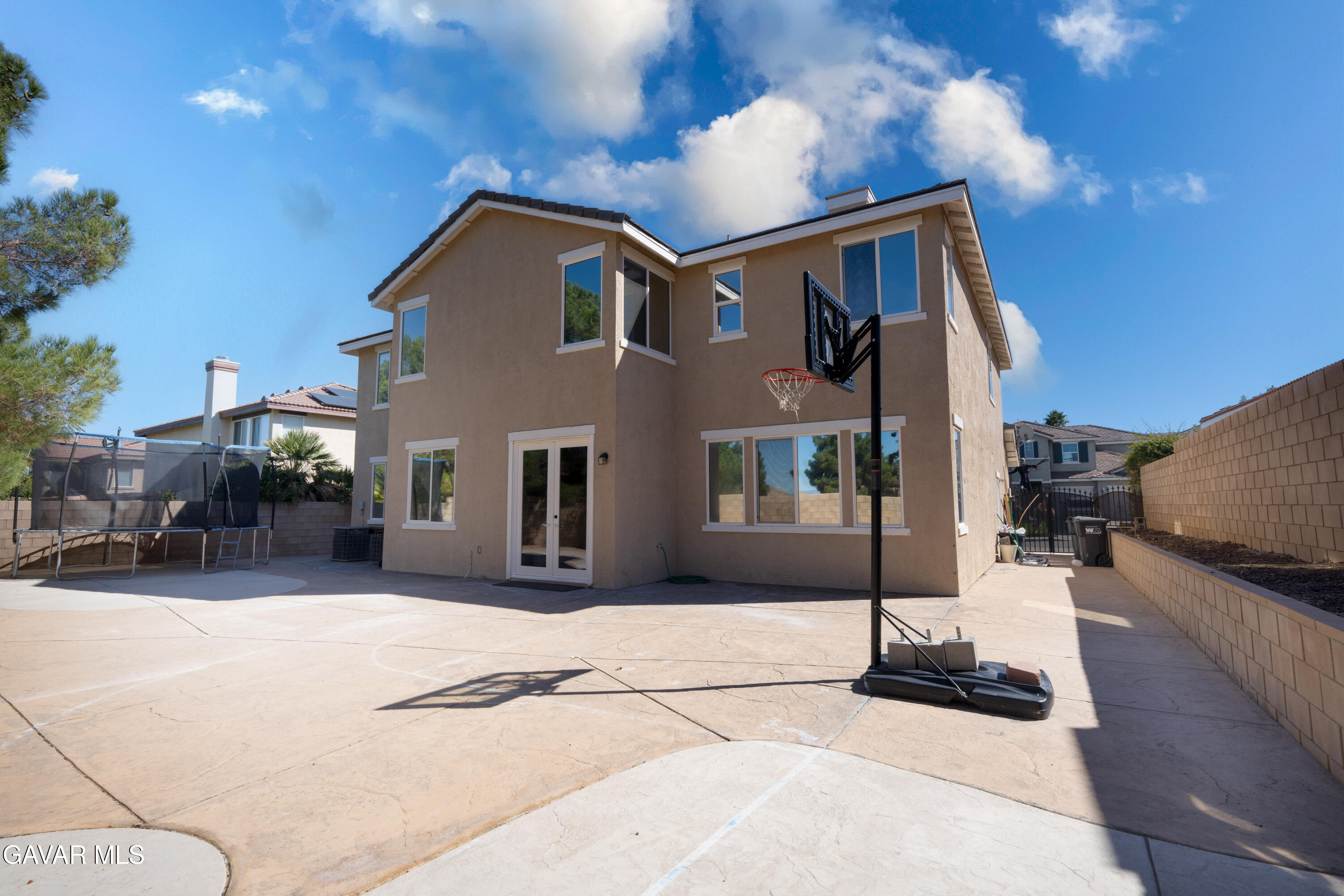 40271 Preston Road Palmdale, CA 93551 - Photo 32 of 38 a front view of a house with a yard and garage
