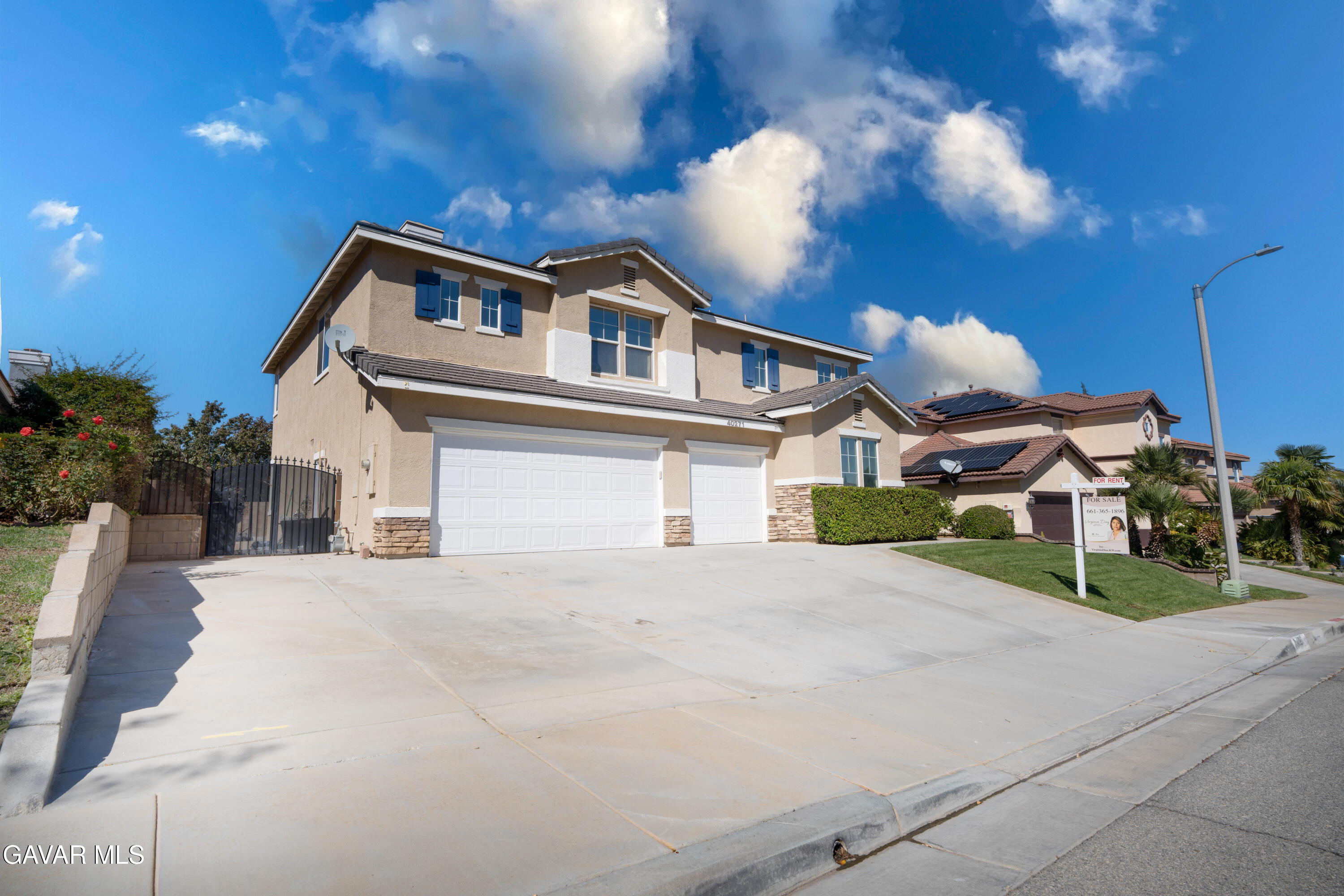 40271 Preston Road Palmdale, CA 93551 - Photo 34 of 38 a front view of a house with a yard and garage