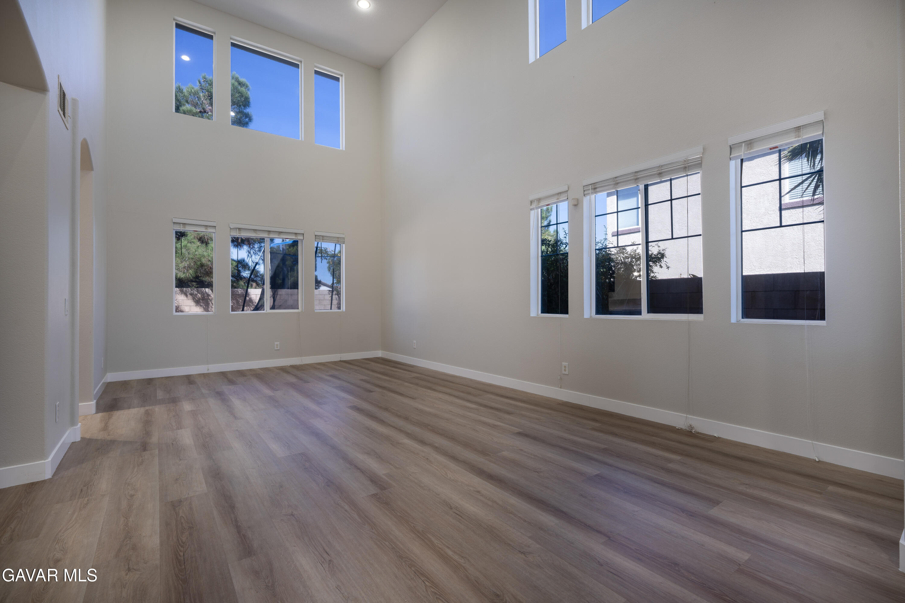 40271 Preston Road Palmdale, CA 93551 - Photo 4 of 38 a view of an empty room with wooden floor and a window