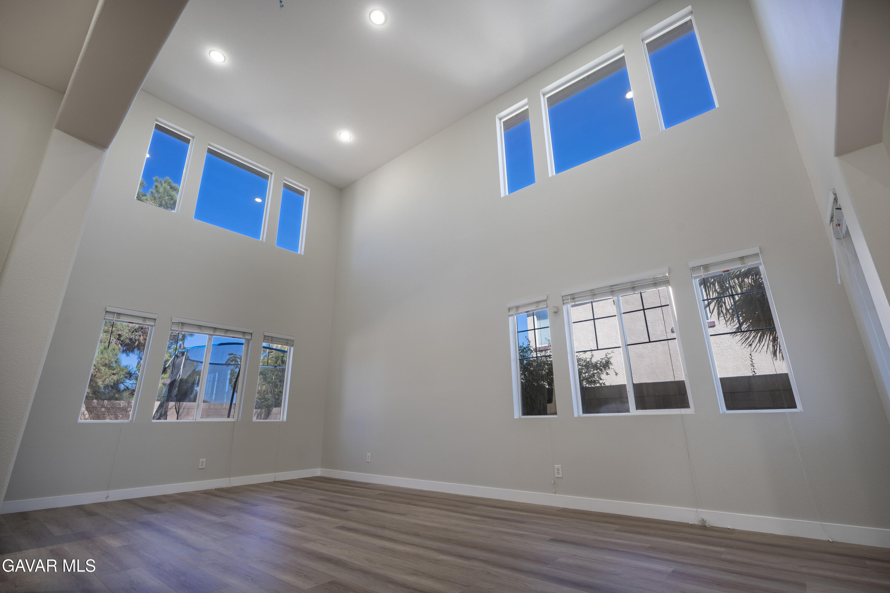 40271 Preston Road Palmdale, CA 93551 - Photo 5 of 38 a view of an empty room with wooden floor and a window