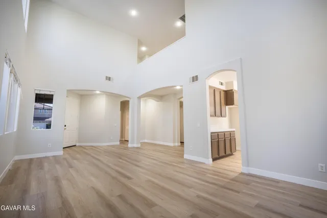a kitchen with stainless steel appliances a sink stove and refrigerator