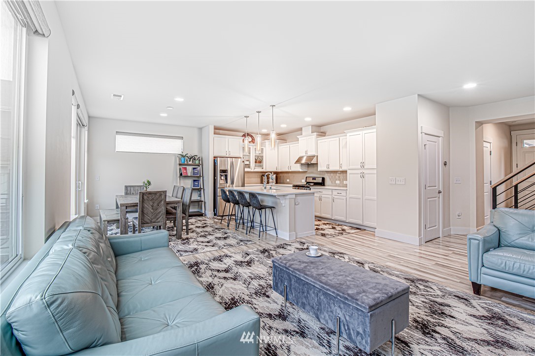 17626 115th Place Southeast Renton, WA 98055 - Photo 2 of 18 a living room with furniture and kitchen view