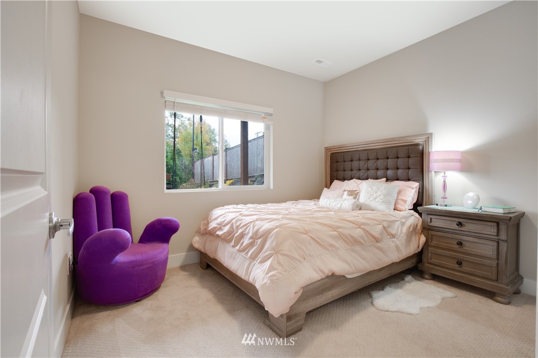 17626 115th Place Southeast Renton, WA 98055 - Photo 11 of 18 a bedroom with a bed and a window