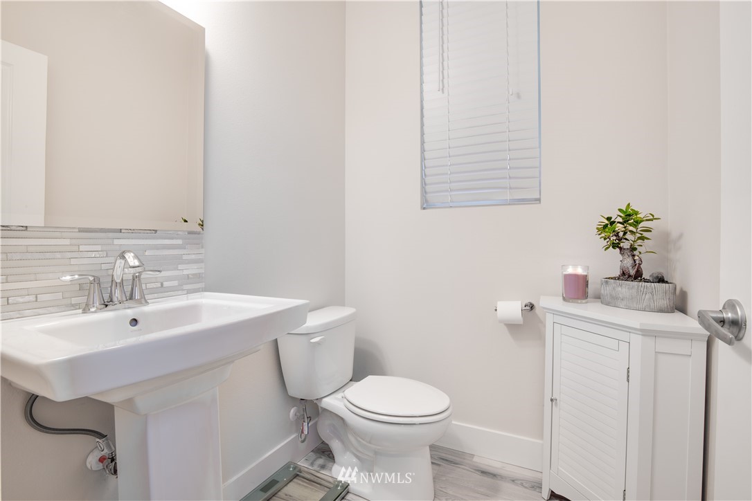 17626 115th Place Southeast Renton, WA 98055 - Photo 6 of 18 a bathroom with a sink toilet and a mirror