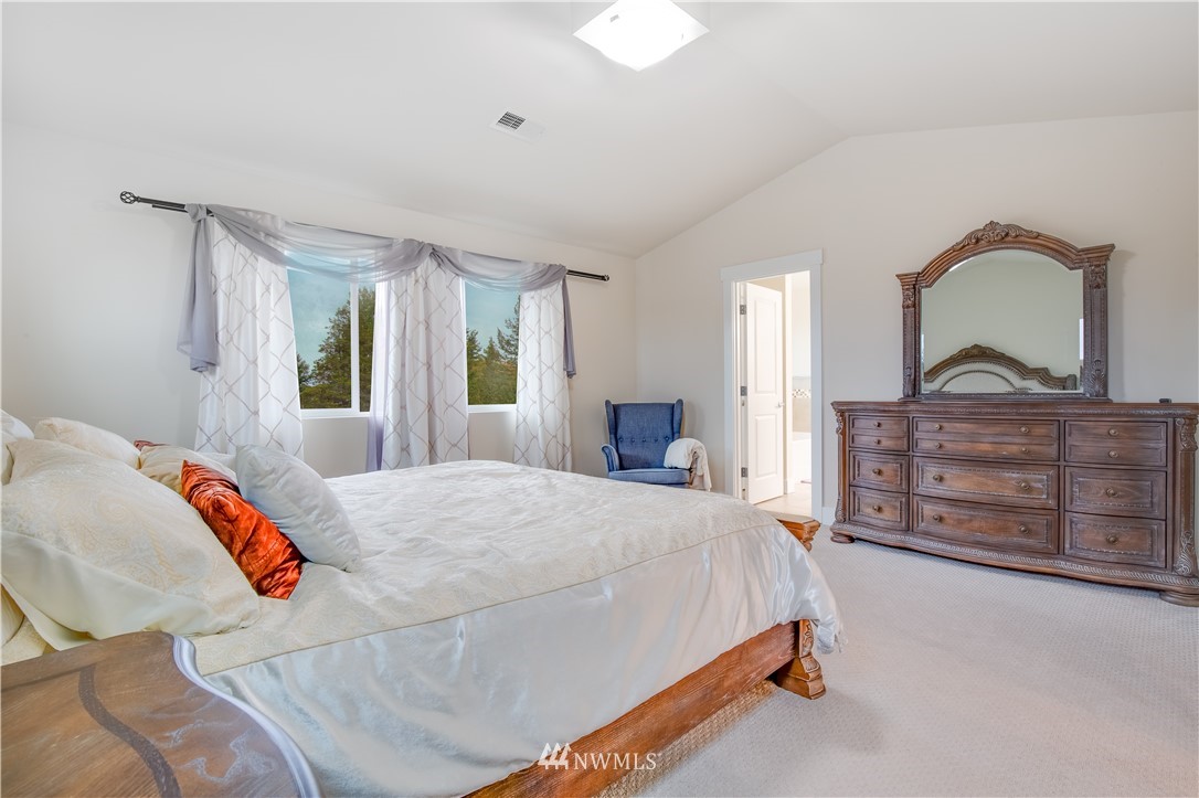 17626 115th Place Southeast Renton, WA 98055 - Photo 8 of 18 a bedroom with a bed and a dresser